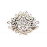 Victorian diamond brooch designed as a leafy flowerhead, claw-set with old-, eight- and rose-cut