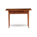 A Cape fruitwood and pine peg-top table, 19th century the rectangular top above a frieze with a