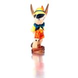 An Italian earthenware figure of Pinocchio, Ugo Zaccagnini, mid 20th century the standing figure