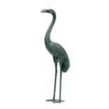 A Japanese bronze figure of a standing crane, Meiji Period (1868-1912) realistically rendered,