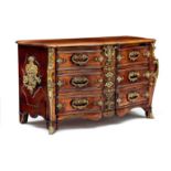 A Régence ormolu-mounted rosewood commode, 18th century the moulded serpentine top above two short