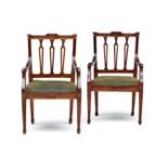 A pair of Cape Neo-Classical stinkwood armchairs, early 19th century each with curved carved top-