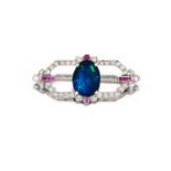 Art Deco black opal, diamond and ruby brooch the open framework set to the centre with a black