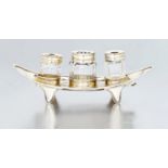 A George III silver inkstand, Henry Chawner, London, 1795 the boat-shaped stand raised on four