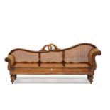 A Colonial rosewood and caned settee, 19th century the shaped back with entwined double-leaf