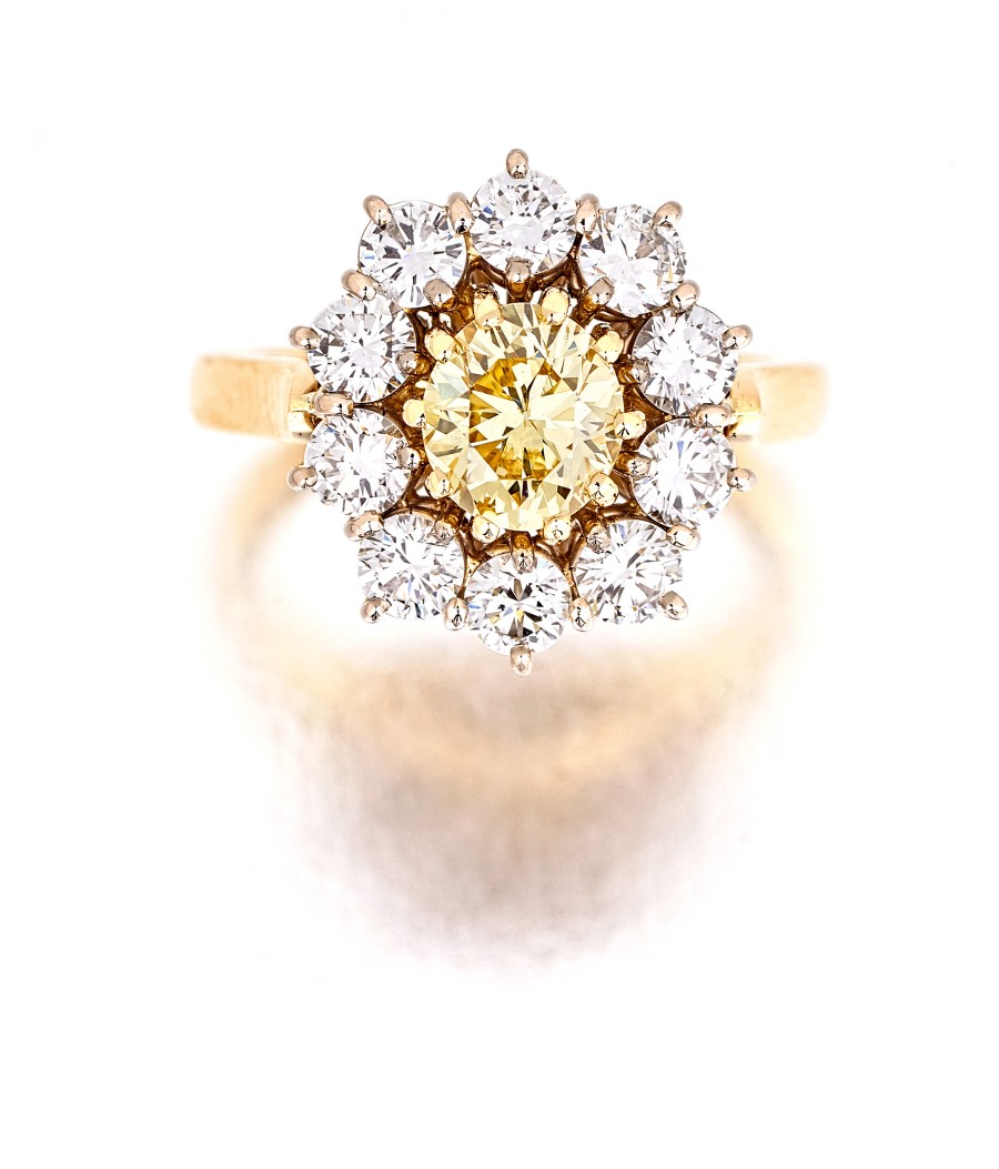 Diamond dress ring, David Thomas, London "claw-set to the centre with a vivid fancy yellow oval-