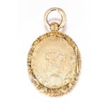 Victorian gold locket oval, the double-hinged covers engraved with flowerheads within a foliate