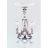 A Victorian silver and glass epergne, Walker & Hall, Sheffield, 1898 the tri-form base centred by