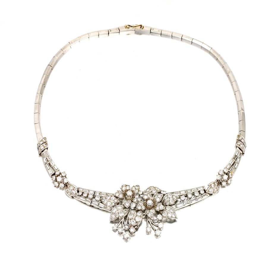 French diamond necklet designed as a floral spray with articulated drops flanked by leafy