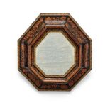 A Dutch marquetry, ebony and parcel gilt mirror, 18th century the octagonal bevelled plate with a