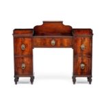 A Regency mahogany and inlaid twin-pedestal sideboard the central drawer with moulded gallery and