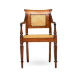 A Colonial teak and caned armchair, 19th century the rectangular back inset with a caned panel, with