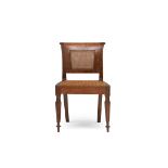A Colonial teak and caned side chair, 19th century the rectangular back inset with a caned panel,