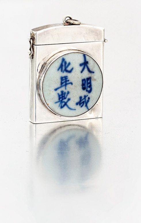 A Chinese porcelain-mounted silver case, 20th century collet-set to the front with a circular blue