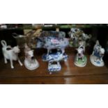 Four various pottery cow creamers; toget
