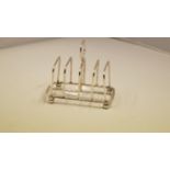 A Victorian silver toast rack, by James