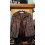 A brown mink waist length fur jacket; to