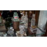 A small group of glass bottles and simil