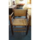 A 19th century beech, fruitwood and rush armchair, with bobbin and reel turnings. Condition