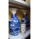 A pair of Chinese blue and white vases, (crack to rim of one), 40cm high; together with a German