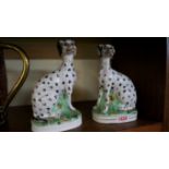 A rare pair of Victorian Staffordshire pottery Dalmatians, 21cm high, (s.d.). Condition Report: