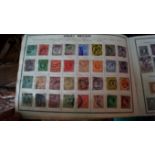 Stamps: four albums of mixed world stamp