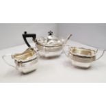 A silver three piece tea set, by James D