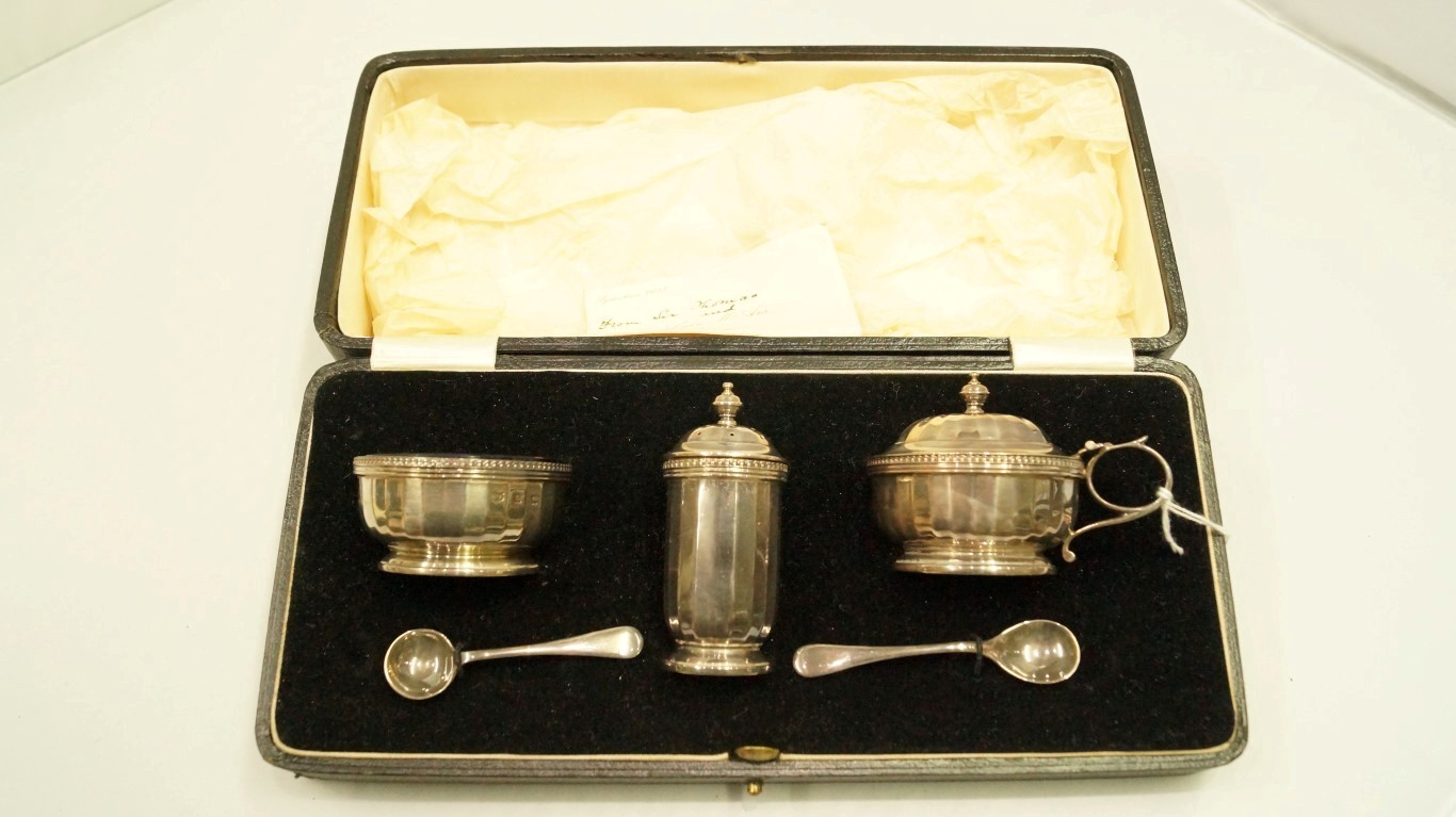 A cased silver three piece condiment set