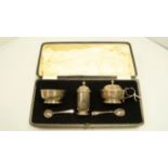 A cased silver three piece condiment set