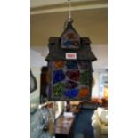 An old metal and coloured glass lantern.