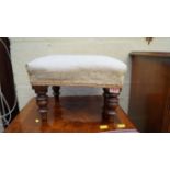 An antique walnut and upholstered stool,