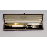 A cased silver gilt christening knife and fork, by Harrison Brother & Howson, Sheffield 1927, having