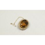 An unmarked brooch set oval citrine surr