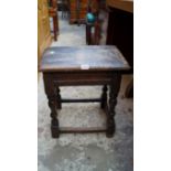 An antique oak joint stool, 42cm wide; together with another 17th century style oak stool, with