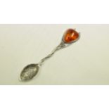 A Scandinavian coffee spoon, with inset amber bead to terminal.