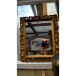 A carved giltwood framed rectangular wal