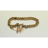 A 9ct gold bracelet with heart shaped cl