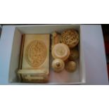 A small quantity of ivory items, to include: a carved ivory card case; two Chinese ivory circular
