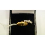 An 18ct gold ring set five stones; and a