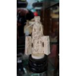 A Dieppe carved ivory triptych figure, possibly Mary I, her robes opening to reveal further figures,