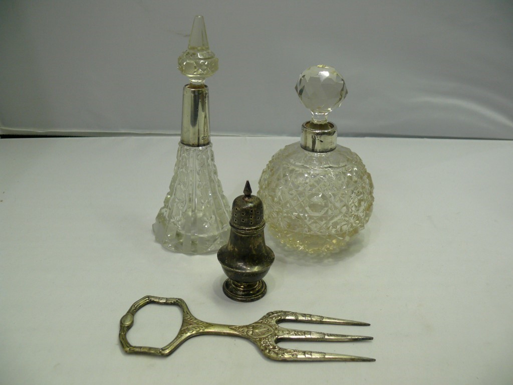 Two silver mounted cut glass scent bottl