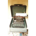 A vintage Corona typewriter, in case.