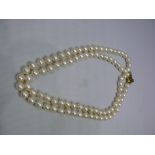 A baroque pearl single strand necklace,