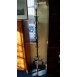 An old wrought iron standard lamp, with