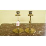 A pair of late 19th century brass candle