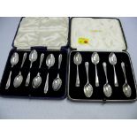 Two cased sets of six silver coffee spoo