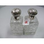 A pair of Victorian silver lidded cut gl