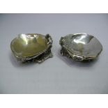 A pair of 19th century silver plated oyster shell dishes and stands, by S G, Sheffield, stamped no