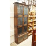 An oak sectional four tier bookcase, eac