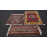 Three various rugs.